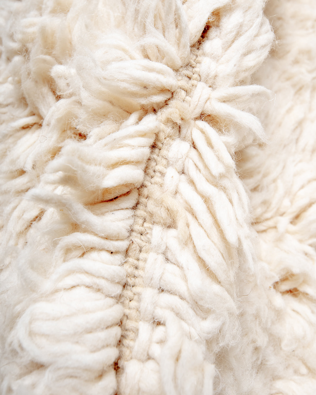 Modern, designer, handcrafted Berber rug from Morocco. Beniourain carpet with minimalist design, natural wool pile and a fluffy texture.